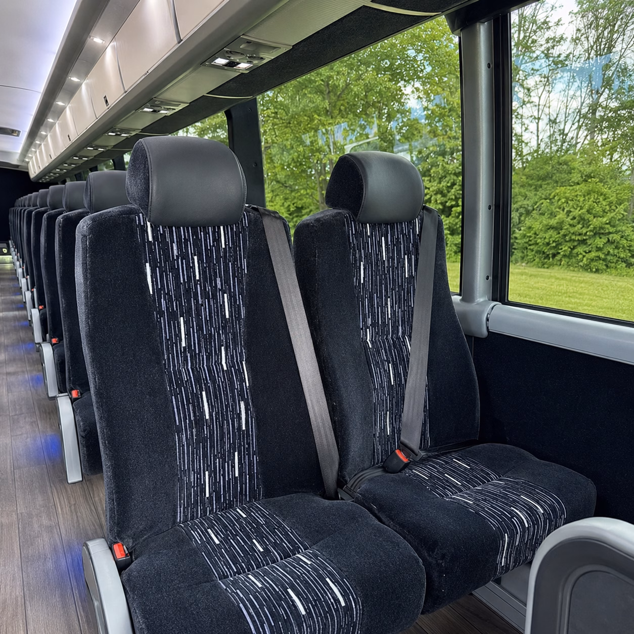 how distance and duration affect charter bus rates in livonia michigan